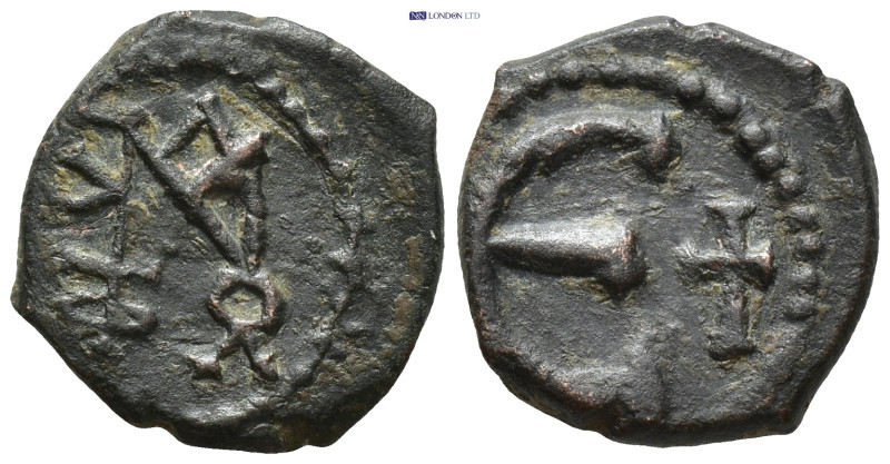 Justin II. 5 Nummi. 569-578 AD. Antioch. AE. (1.8 Gr. 14mm.)
Monogram. 
Rev. Lar...