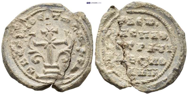 Byzantine Lead Seal. (23mm, 7.22 g) Obv: Patriarchal cross with floral ornaments...