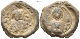 Byzantine Lead Seal. (27mm, 12.67 g) Obv: Facing bust of Saint, raising hand in benediction and holding Book of Gospels. Rev: MP-ΘY Nimbate facing bus...