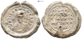 Byzantine Lead Seal. (29mm, 9.76 g) Obv: Saint bust facing. Rev: Legends in five lines.