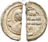 Byzantine Lead Seal. (30mm, 7.39 g) Obv: MP-ΘY Nimbate facing bust of the Virgin Mary, orans. Rev: Legends in four lines.