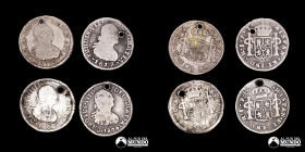 Chile, Santiago. Lote de cuatro monedas de plata: ½ Real 1799, 1800, 1804 (Carlos IV) y 1817 (Fernando VII).
