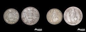 Suiza. Pareja de monedas de plata: 1 Franco, 1963; 2 Francos, 1944.
