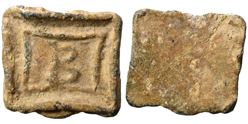 Greek weight (lead, 6.95 g, 21x20 mm). Sold as seen.