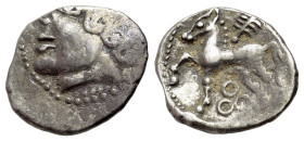 Central Gaul, Bituriges Cubi, c. 1st century BC. AR Quinarius (13mm, 1.93g, 6h). Bare male head l. R/ Horse prancing l.; branch above; three circles b...