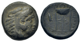 Macedon, Philippi, c. 356-345 BC. Æ (21,5mm, 4,80 g). Head of Herakles right, wearing lion’s skin. R/ Tripod; to left, monogram above grain ear. Belli...