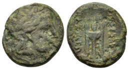 Kings of Macedon. Kassander (305-298 BC). Æ Unit (18,5mm, 5.60g). Uncertain mint in Macedon. Laureate head of Apollo right. R/ Tripod; two monograms i...