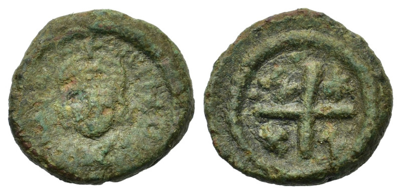 Justinian I (527-565). Æ 10 Nummi (14,2mm, 2.8g). Ravenna, 547-552. Helmeted and...