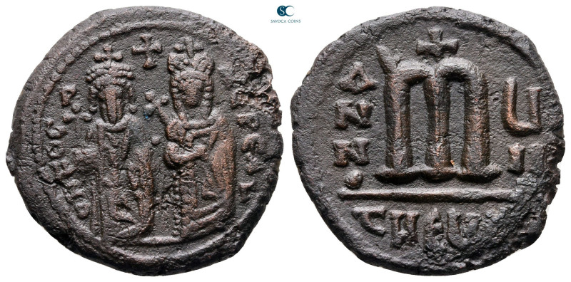 Phocas, with Leontia AD 602-610. Theoupolis (Antioch)
Follis or 40 Nummi Æ

2...