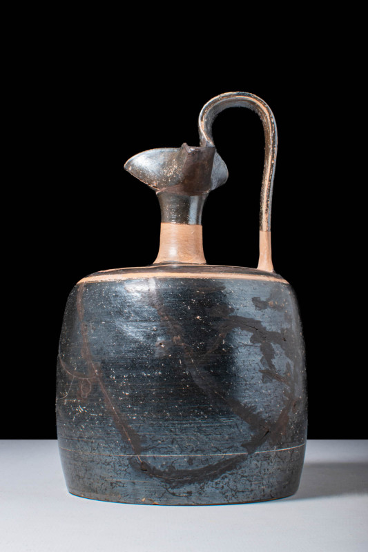 ATTIC OINOCHOE WITH CYLINDRICAL BODY

 Ca. 450 - 380 BC An Attic black figure ...