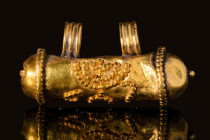 ROMANO-JEWISH GOLD BULLA PENDANT WITH MENORAH 

 Ca. AD 100 - 200 A Romano-Jewish gold bulla pendant with filigree decoration depicting a Menorah on...