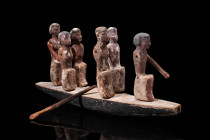 EGYPTIAN WOODEN SHIP MODEL

 Ca. 2030 -1640 BC An Egyptian carved and painted wooden boat with six boatmen. The men at the front and rear ends of th...