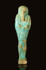 EGYPTIAN FAIENCE USHABTI WITH HIEROGLYPHIC INSCRIPTION

 Late Period, Ca. 664 - 332 BC An Egyptian faience ushabti, intricately crafted with layers ...