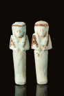 PAIR OF EGYPTIAN FAIENCE USHABTIS WITH BLACK DETAILS

 New Kingdom - Third Intermediate Period, Ca. 1069 - 945 BC A set of Egyptian faience ushabti ...