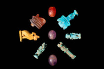 GROUP OF EGYPTIAN STONE AND FAIENCE AMULETS

 Third Intermediate Period - Late Period, Ca. 1069 - 332 BC An group of nine mould-formed faience amule...