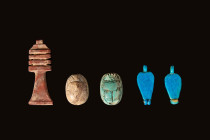 GROUP OF EGYPTIAN AMULETS

 New Kingdom - Late Period, Ca. 1700 - 332 BC An ensemble of five carved stone and faience amulets. First on the left is ...