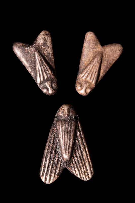 SET OF THREE EGYPTIAN SILVER FLY AMULETS

 New Kingdom, Ca. 1550 - 1069 BC A s...