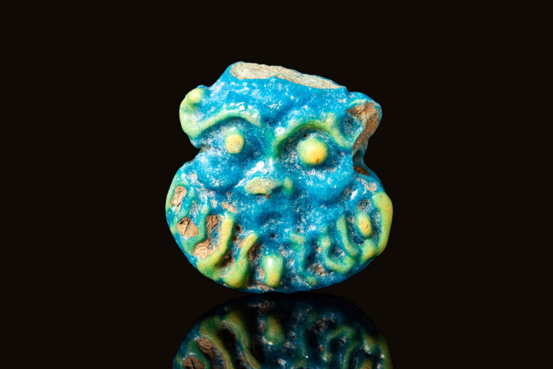 EGYPTIAN FAIENCE AMULET OF BES

 New Kingdom, Ca. 1550 - 1069 BC An Egyptian m...