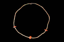 EGYPTIAN NECKLACE WITH CARNELIAN ROUND CENTRAL BEAD

 Late period, Ca. 664 - 332 BC An Egyptian late period necklace made from green and yellow faie...