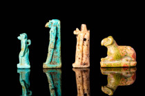 GROUP OF EGYPTIAN FAIENCE AMULETS

 New Kingdom - Late Period, Ca. 1550 - 332 BC An Egyptian group of 4 mould-formed faience amulets covered in lust...