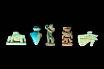 GROUP OF EGYPTIAN FAIENCE AND STONE AMULETS

 New Kingdom - Late Period, Ca. 1550 - 332 BC An Egyptian group of 5 mould-formed faience amulets cover...