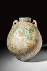 EGYPTO - ROMAN FAIENCE AMPHORISKOS

 Ca. 30 BC - AD 100 A rare Egypto-Roman green glazed amphoriskos. The vessel exhibits a large globular body, a c...