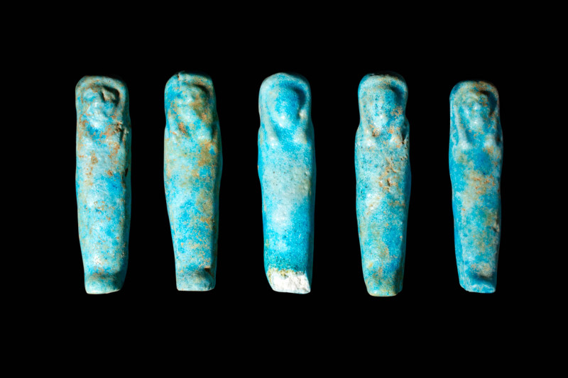 GROUP OF FIVE EGYPTIAN FAIENCE USHABTIS

 Late Period - Ptolemaic Period, Ca. ...