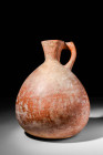 BURNISHED CYPRIOT POTTERY JUG WITH POLISHED SURFACE

 Ca. 2300 - 1650 BC A Cypriot or Holy Land pottery jug of attractive form with a large pear sha...