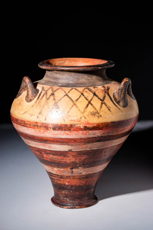 MYCENAEAN POTTERY JAR WITH BICHROME STRIPES

 Ca. 1400 - 1300 BC An elegant wh...