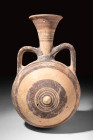 LARGE CYPRIOT BICHROME POTTERY JUG

 Ca. 750 - 600 BC A Cypriot bichrome pottery jug decorated with concentric black and red circles on the neck. Th...