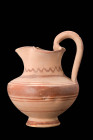 DAUNIAN PAINTED TREFOIL OINOCHOE

 Ca. 550 - 400 BC A Daunian trefoil pottery oinochoe. This bulbous vessel has a trefoil spout and is decorated wit...