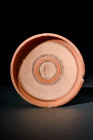CYPRIOT TERRACOTTA CUP WITH CENTRAL MOTIF

 Ca. 900 - 700 BC A Cypriot pottery cup with a cream-coloured base embellished with groups of linear deco...