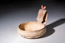 DAUNIAN KYATHOS WITH EYES

 Ca. 600 - 500 BC A Daunian terracotta kyathos featuring a shallow bowl with a flat openwork handle stylised into the hea...