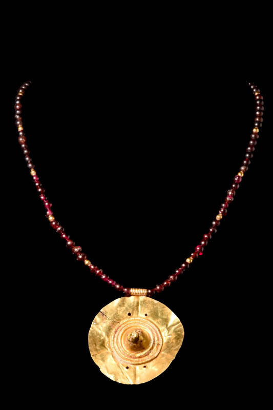 HELLENISTIC GOLD PENDANT AND NECKLACE

 Ca. BC 400 - 300 A gold pendant on a b...