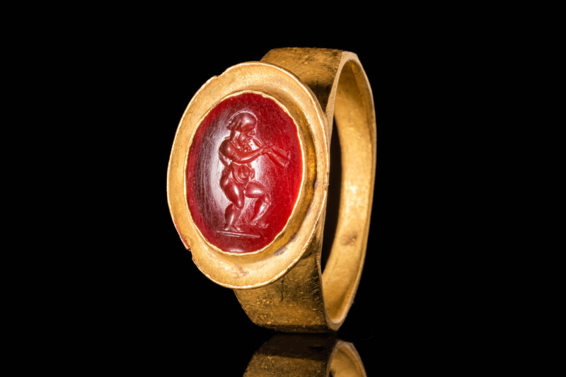 HELLENISTIC GOLD RING WITH CARNELIAN INTAGLIO DEPICTING MARSYAS

 Ca. 200 - 10...