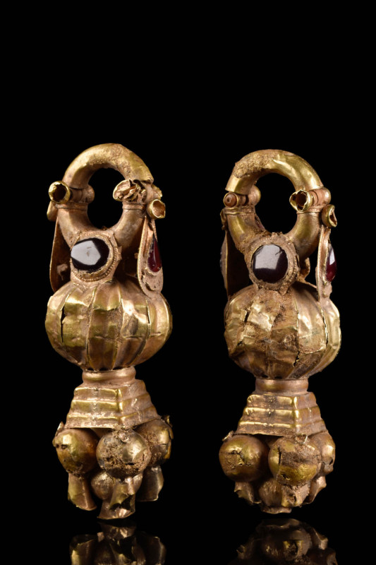 HELLENISTIC MATCHED PAIR OF GOLD EARRINGS

 Ca. 400 - 300 BC A pair of gold ea...