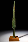 EARLY GREEK BRONZE SWORD

 Ca. 1200 - 800 BC An Early Greek bronze sword with a long, tapering blade, a prominent mid-rib and a gracefully curved gu...