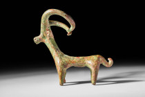 GREEK BRONZE STATUETTE OF IBEX

 Ca. 700 - 500 BC A Greek bronze figurine of an ibex with a tubular body standing on four legs with a raised short t...