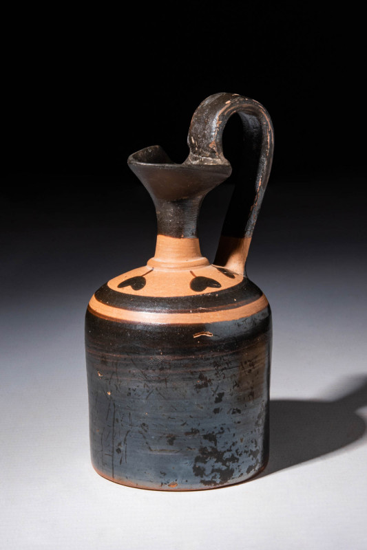 ATTIC BLACKWARE OINOCHOE WITH LEAVES PATTERN

 Ca. 450 - 400 BC An Attic black...