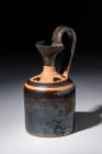 ATTIC BLACKWARE OINOCHOE WITH LEAVES PATTERN

 Ca. 450 - 400 BC An Attic blackware pottery oinochoe pitcher with a trefoil spout decorated with hear...
