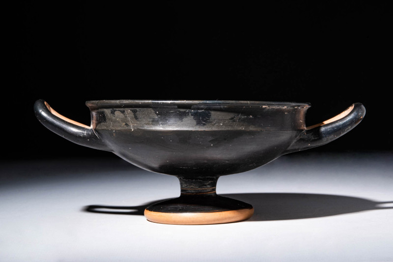 GREEK BLACK GLAZED KYLIX WITH STANDING BASE 

 Ca. 480 - 450 BC A Greek black ...