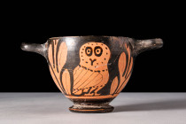 ATTIC RED FIGURE SKYPHOS WITH OWLS

 Ca. 400 - 300 BC An Attic red-figure pottery skyphos, a dual-handled, deep cup with a low flanged base, used fo...