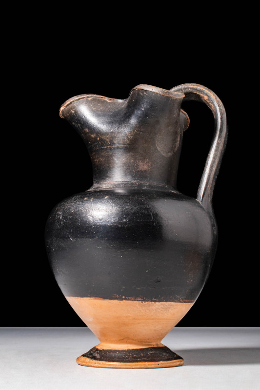 GREEK BLACK GLAZED TREFOIL OINOCHOE

 Ca. 450 - 380 BC A Greek pottery black g...