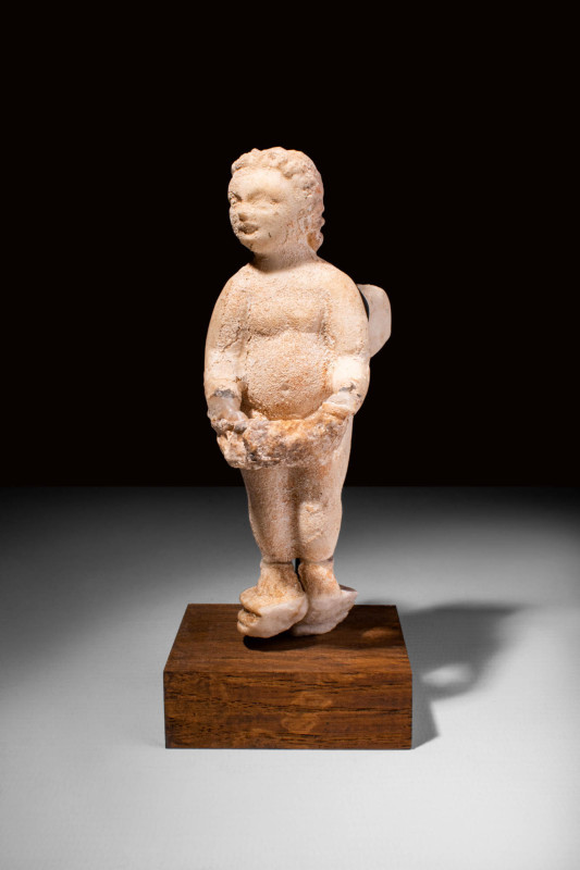 ROMAN MARBLE WINGED CUPID 

 Ca. AD 100 - 300 A Roman marble statue of a winge...