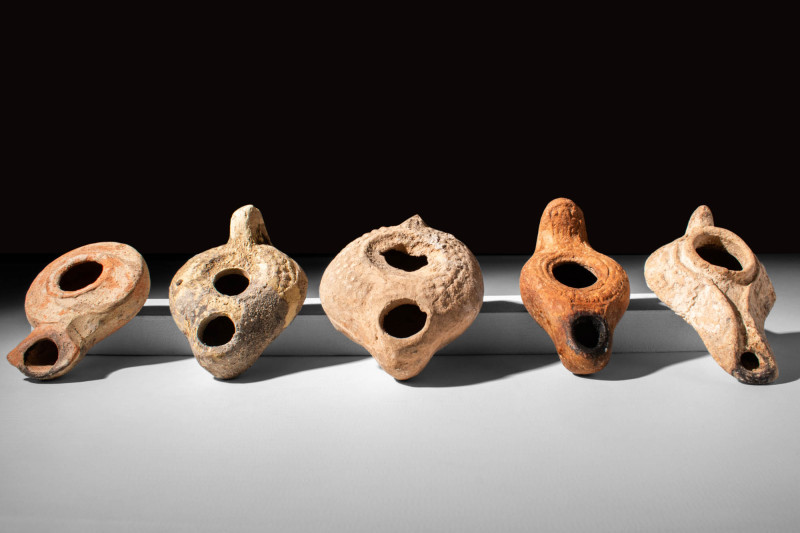 GROUP OF FIVE LEVANTINE TERRACOTTA OIL LAMPS

 Ca. AD 400 - 600 A set of five ...