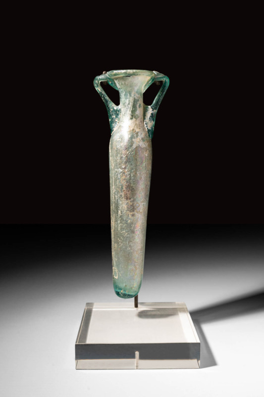 TALL ROMAN BLOWN GLASS AMPHORISKOS

 Ca. AD 300 - 500 A marvellous Roman free-...