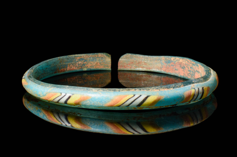 ROMAN MOSAIC GLASS BANGLE

 Ca. AD 200 - 300 A Roman glass multi-colored glass...