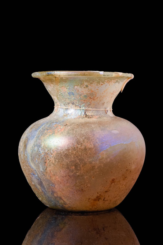 ROMAN GLASS GLOBULAR JAR

 Ca. AD 100 - 300 A Roman glass globular jar with an...