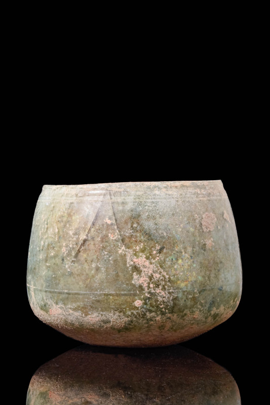 ROMAN GREEN GLASS BEAKER

 Ca. AD 100 - 300 A Roman green glass beaker compose...