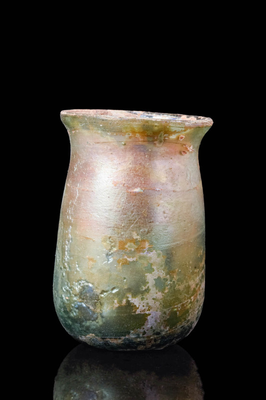 ROMAN GREEN GLASS BEAKER

 Ca. AD 100 - 300 A Roman green glass beaker compose...